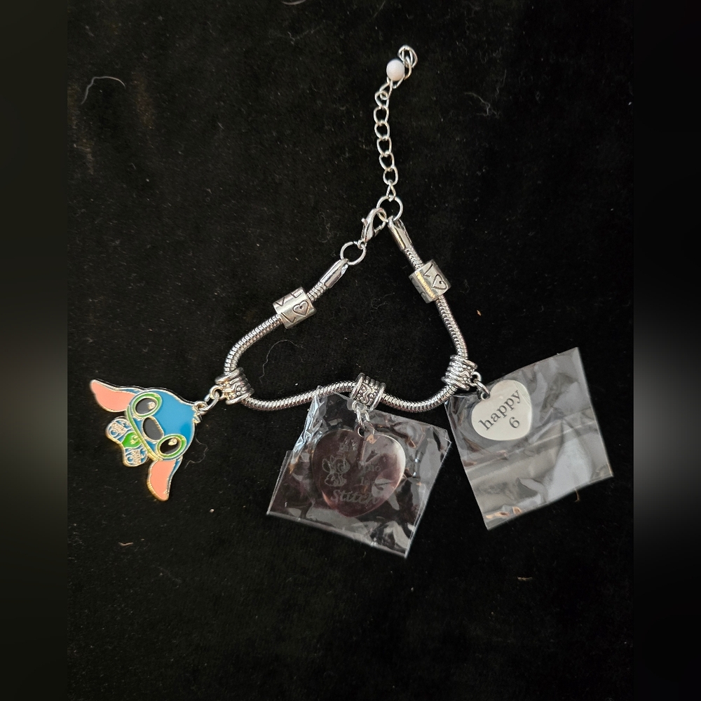 Silver Stich Themed Charm  Bracelet With 2 Additional Charms